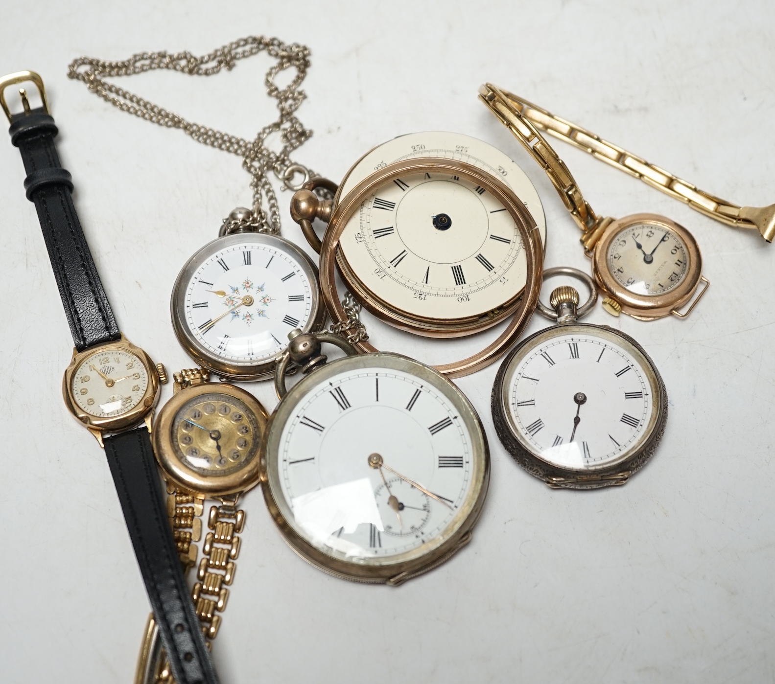 Two lady's 9ct gold manual wind wrist watches on gold plated straps, a gold plated wrist watch, two fob watches and two pocket watches. Condition - poor to fair